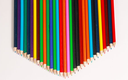 a row of colored pencils in a line