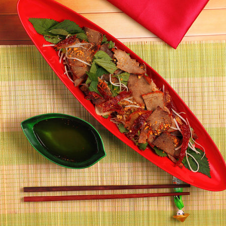 beef salad vietnamese style served on a bamboo place mat