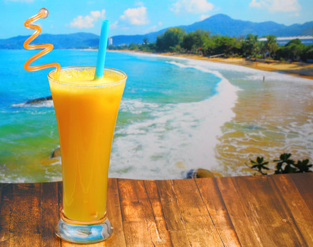 pineapple juice in glass on wood table top on an islandの写真素材
