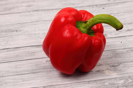 red paprika on a wood table topの写真素材