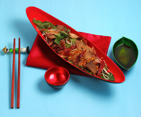 beef salad vietnamese style served on a blue backgroundの写真素材