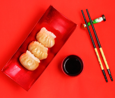 Vietnam style steamed shrimp dumplings served on a red backgroundの写真素材