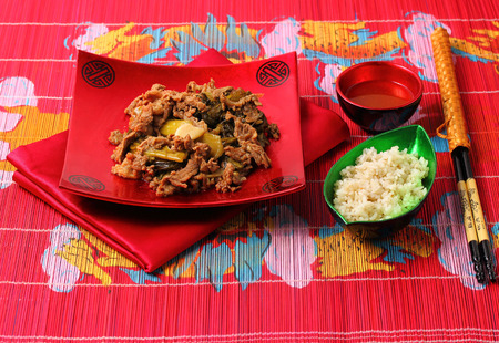 Vietnamese beef stir fry served on a bamboo place matの写真素材