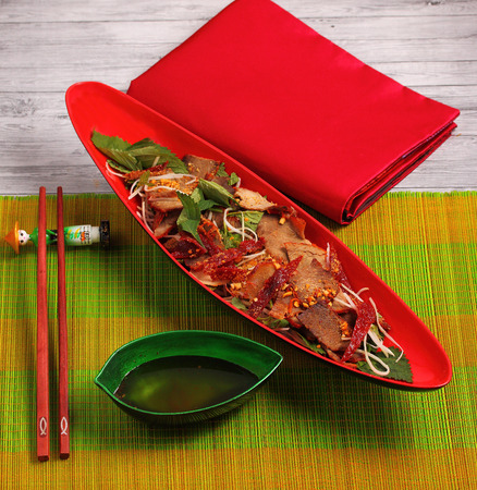 beef salad vietnamese style served on a bamboo place matの写真素材