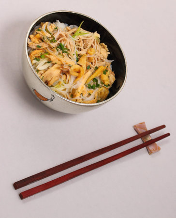 Vietnamese vermicelli chicken and rice noodles soup, pho, on a white background