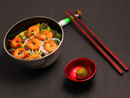 Vietnamese shrimp and rice noodles soup, pho on a black backgroundの写真素材