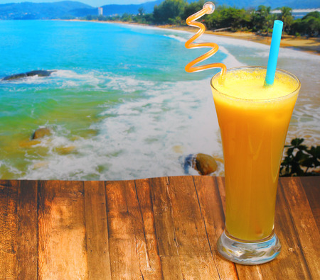 pineapple juice in glass on wood table top on an islandの写真素材