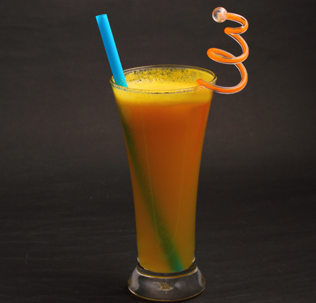 pineapple juice in glass on a grey black backgroundの写真素材