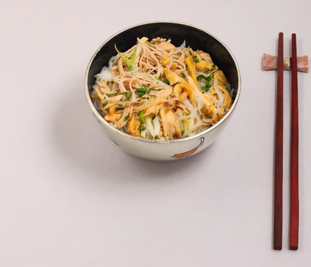 Vietnamese vermicelli chicken and rice noodles soup, pho, on a white backgroundの写真素材