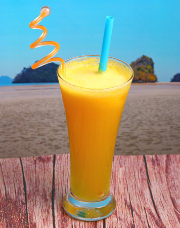 pineapple juice in glass on wood table top on an islandの写真素材