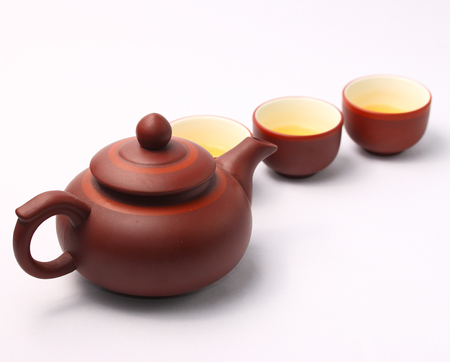 Asian tea set served on a white backgroundの写真素材