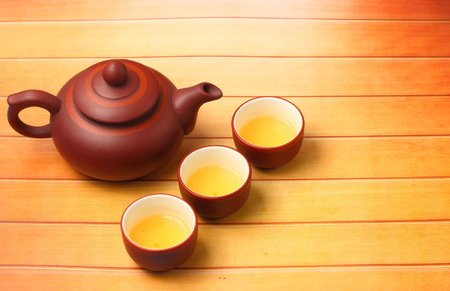 Asian tea set served on a wood table top