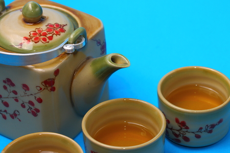 Asian tea set served on a blue table clothの写真素材
