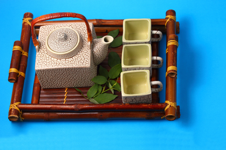 Asian tea set served on a bamboo trayの写真素材