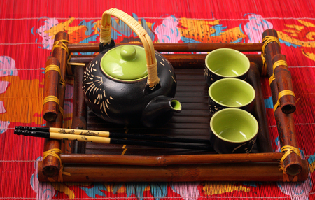 Asian tea set served on a bamboo trayの写真素材
