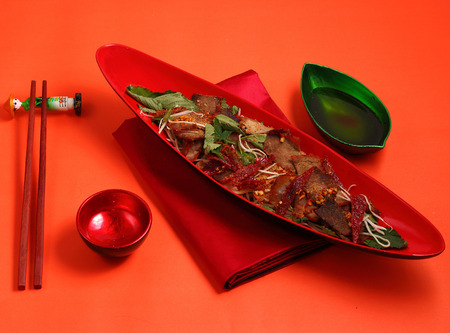 beef salad vietnamese style served on an orange backgroundの写真素材
