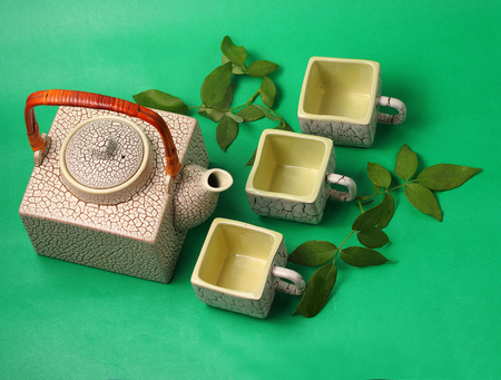 Asian tea set served on a green backgroundの写真素材