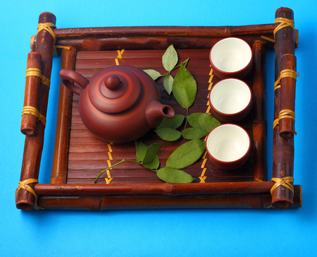 Asian tea set served on a bamboo trayの写真素材