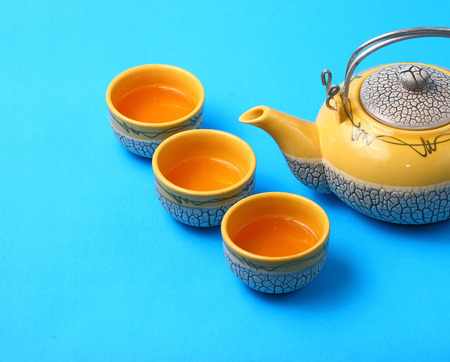 Asian tea set served on a blue table clothの写真素材