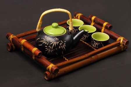 Asian tea set served on a bamboo trayの写真素材