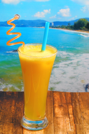 pineapple juice in glass on wood table top on an islandの写真素材