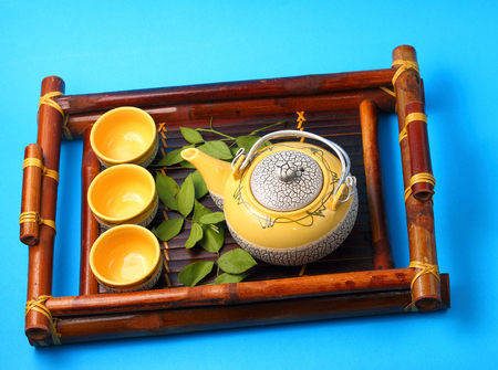 Asian tea set served on a bamboo trayの写真素材