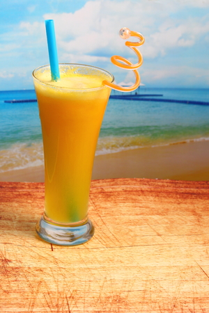 pineapple juice in glass on wood table top on an islandの写真素材
