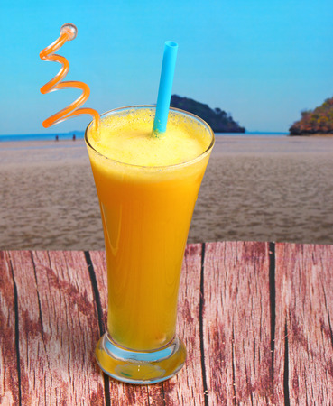 pineapple juice in glass on wood table top on an islandの写真素材