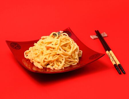 spaghetti  carbonara served on a red blackgroundの写真素材