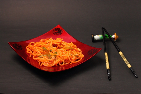 amatriciana spaghetti served on a black backgroundの写真素材