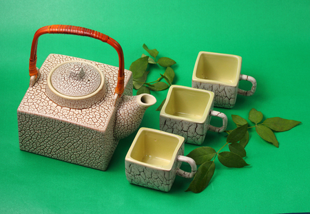 Asian tea set served on a green backgroundの写真素材