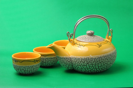 Asian tea set served on a green backgroundの写真素材