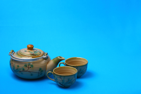 Asian tea set served on a blue table clothの写真素材