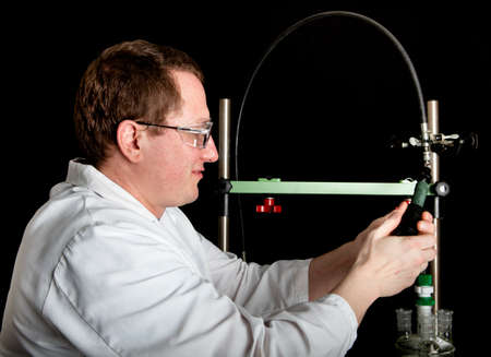 Scientist setting up his test equipmentの写真素材