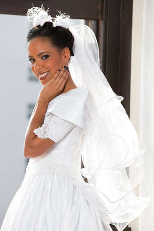 Beautiful Bride looking out a windowの写真素材