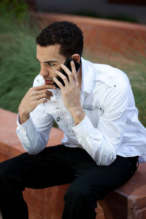 Good Looking Guy in his twenties Talking on a cell phoneの写真素材
