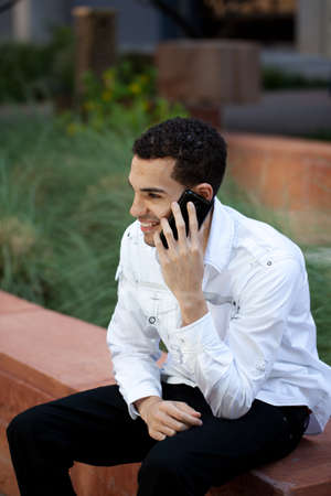 Good Looking Guy in his twenties Talking on a cell phoneの写真素材