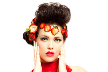Beautiful Woman Decorated with Strawberries in redの写真素材