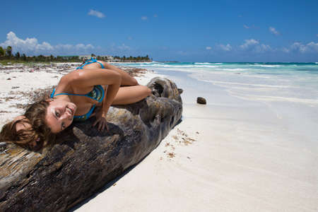 Young beautiful women in a Bikini on the sunny tropical beachの写真素材