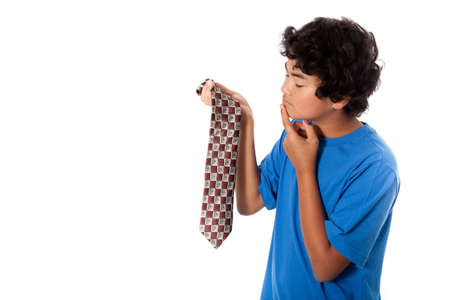 Asian Teenager picking out a tie for his dad on Fatherの写真素材