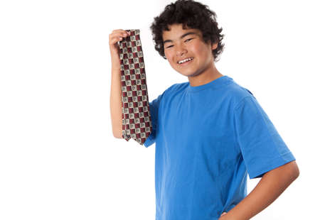 Asian Teenager picking out a tie for his dad on Fatherの写真素材