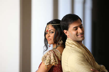 Gorgeous Indian bride and groom traditionally dressedの写真素材