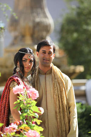 Image of a gorgeous Indian bride and groom traditionally dressedの写真素材