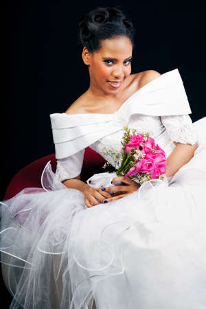 Gorgeous Bride with a Bouquet of roses shot in studioの写真素材