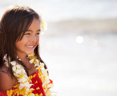 Pretty Hula Girl  at the beach wearing a handmade flower leiの写真素材