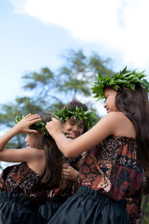 Hula girls on the beach getting ready to danceの写真素材
