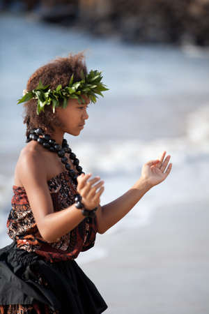 Pretty Hula Girl dancing at the beach wearing a handmade head pieceの写真素材