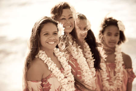 Pretty Hula Girl  at the beach wearing a handmade flower leiの写真素材