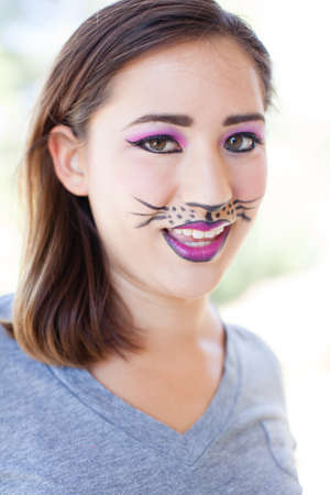 Pretty Brunette woman in cat makeupの写真素材
