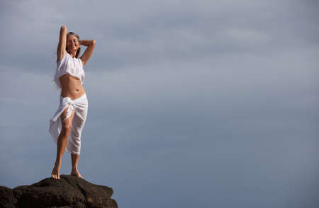 Beautiful  Woman with Long Hair on the Beach in Hawaii's morning sunの写真素材